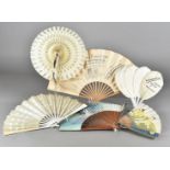 A collection of eleven Victorian and later paper and wooden stick Advertising fans, all for London