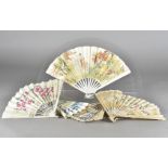 Opera Comique, a folding paper and wooden stick fan, obverse with printed scene of courting couples,