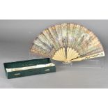 The Greenwich Millennium limited edition commissioned paper and wooden stick fan, the leaf with