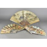 Two paper and wood folding theatre fans, both for The Mikado, a scene in Koko's garden, from 'The