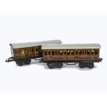 A Pair of Bing O Gauge 'Shortie' Bogie Coaches, in LMS maroon livery, comprising a 1st/3rd