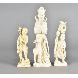 Three 19th Century Japanese ivory okimono figures, modelled as an elder with deer, 20 cm high,