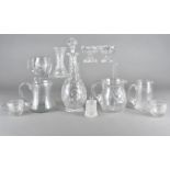 A collection of cut glass ware, including four jugs, three punch cups, an ovoid decanter and stopper