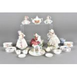Two Royal Doulton figures, Home Again HN 2167 and Babie HN 1679 together with various napkin