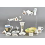 A collection of crestedware, including a porcelain figure of begging dog with basket of flowers, a