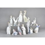 A collection of Lladro and Nao porcelain figures, to include a boxed figure of a clown and his