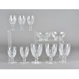 A set of eleven Waterford cut glass wine goblets, together with a matching set of seven smaller