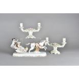 A Dresden porcelain figure group, modelled as a troika and passenger being pulled by a dapple grey