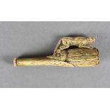A 19th Century carved bone cheroot holder, modelled as a bird beak and head surmounted by jungle