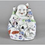 A 20th Century Chinese porcelain Buddha, with nine attendants, 21 cm high