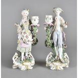 A pair of 19th century continental porcelain figural candle sticks, modelled as a fashionable man