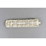 A 19th Century Chinese ivory cribbage board, the central panel with peg holes surrounded by a border