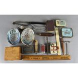 A collection of miscellaneous items, including a patent skirt lifter, a Japanese shakuto,