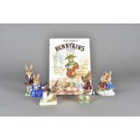 Four Royal Doulton Bunnykins figures, including family photograph, sleigh ride, tally ho, aerobic