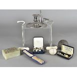 A collection of miscellaneous items, including a gold and pearl stick pin, various mother of pearl