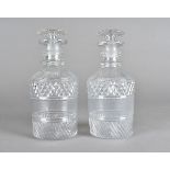 A pair of Georgian cut glass mallet shape decanters, with double ring neck and mushroom stoppers, 19