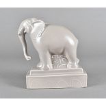 A Poole studio pottery model of an elephant, on a stepped plinth base, printed factory mark to base,
