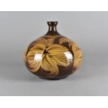 A terracotta studio lamp base, the wheel made globular pot with hand painted floral design, 23 cm