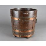 A coopered barrel log basket, with copper to oak body, 36 cm high