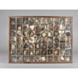 A cased set of seventy geological minerals and crystals, with only two samples missing in teak and