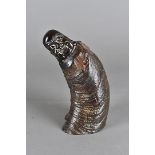 A 19th century carved cow horn Chinese Buddha, the carved laughing head to textured naturalistic