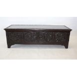 A continental hardwood carved coffer, rectangular shape with hinged lid 151 cm wide x 50 cm deep x