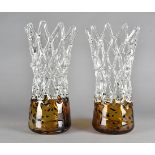 A pair of large decorative glass vases, the amber bases supporting open lattice design bodies, 40 cm