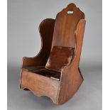 A Georgian mahogany child's wing back rocking chair, and commode