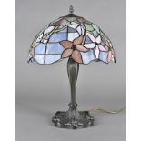 A Tiffany style desk lamp, the metal naturalistic base with glass shade, 51 cm high
