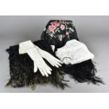 A quantity of textiles, to include a pair of kid leather gloves, an embroidered silk black shawl,