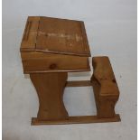A Childs pine desk and stool, 46 cm x 71 cm x