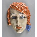 An art deco KWK Keramos Austrian terracotta wall mask, modelled as a fashionable young lady with red