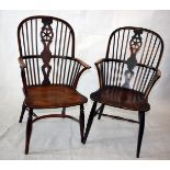 Two 19th century elm seated hoop back arm chairs, one with hoop back stretcher, both with wheel