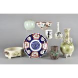 A small group of Japanese ceramics, including a celadon glazed globular vase, an imari plate, an