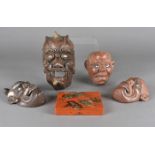 Four Japanese Meiji period noh theatre masks, three in plaster with glass eyes, the other carved