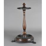 A Brights of Nettlebed stick stand in the Regency style, with circular drip tray four sections