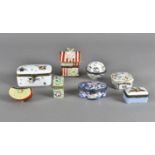 A collection of porcelain hinged lidded trinket boxes, including four by Limoges, one modelled as