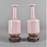 A pair of late 18th early 19th century monochrome Chinese porcelain vases, bottle shaped with
