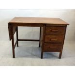 A students single pedestal desk, with drop flap, fitted with three drawers, 99 cm wide x 56 cm