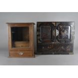 A Japanese lacquered table top cabinet, with two panel doors opening to reveal a fitted drawer