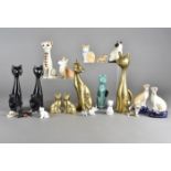 A collection of Beswick, Sylvac, Staffordshire, Wade animal figurines, mostly pussy cats together