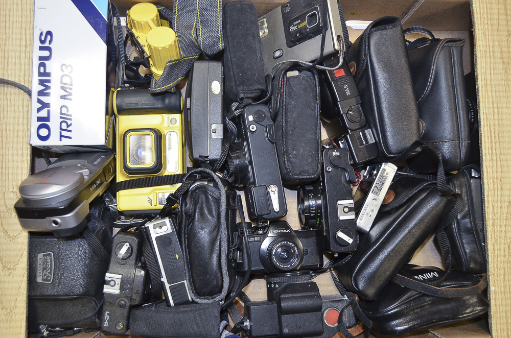 A Tray of Assorted Cameras, including a Pentax 110 SLR, Kodak Disc Cameras, a Minolta Weathermatic