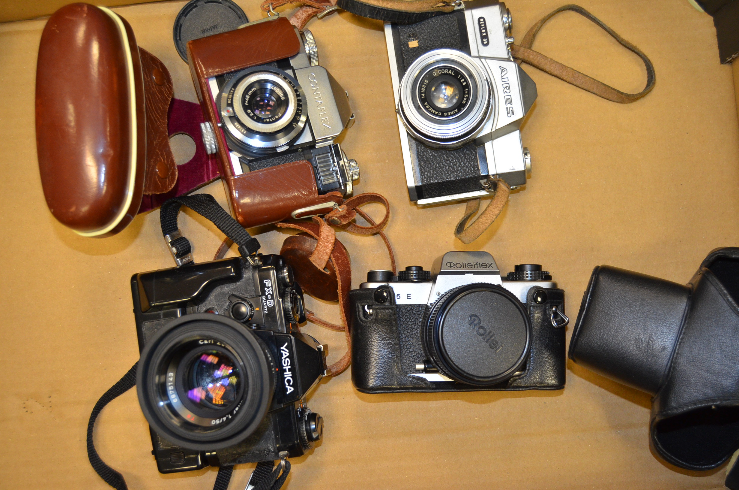 A Tray of SLR Cameras, including a Rolleiflex SL35E with Planar 50mm f/1.8 lens, a Contaflex,