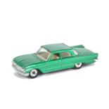 A Scarce Dinky Toys Metallic Emerald Green 148 Ford Fairlane, off-white interior, open windows, spun