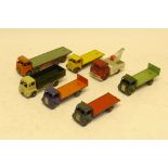 Playworn Dinky Commercial Models, Including four Guy flatbed trucks, a Foden flatbed, Bedford