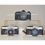 Olympus OM 35mm Cameras, including an OM-1, OM-2n, OM-2 (black) all with 50mm f/1.8 F,Zuiko Auto-S
