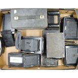 A Tray of Folding Cameras, including roll film backs and film plate holders