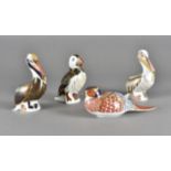 Royal Crown Derby, four paperweights including brown pelican, limited edition white pelican 2577/