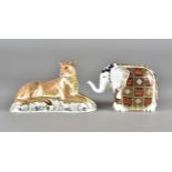 Royal Crown Derby, two paperweights, lioness with gold stopper and elephant with silver stopper (2)