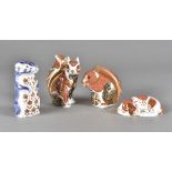 Royal Crown Derby, four paperweights including woodland squirrel, another squirrel, meerkat and